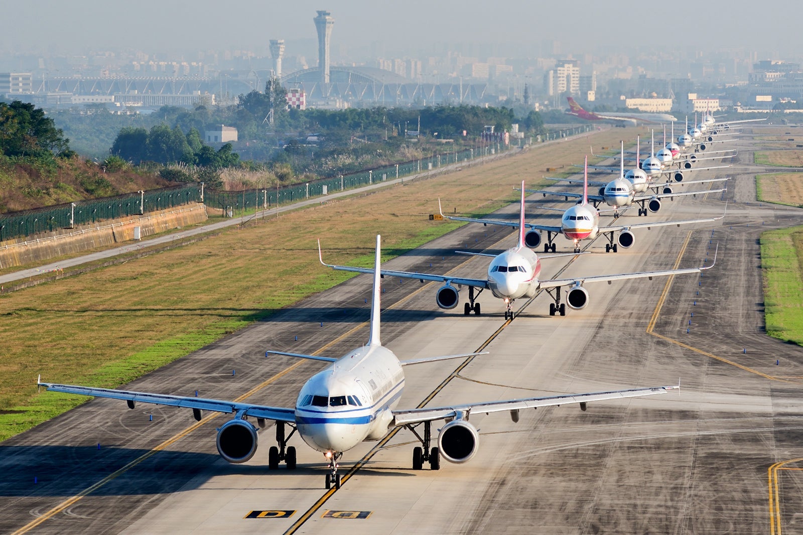 A large number of aircraft sliding in a line for take off in Chengdu Shuangliu International Airport,Sichuan,China