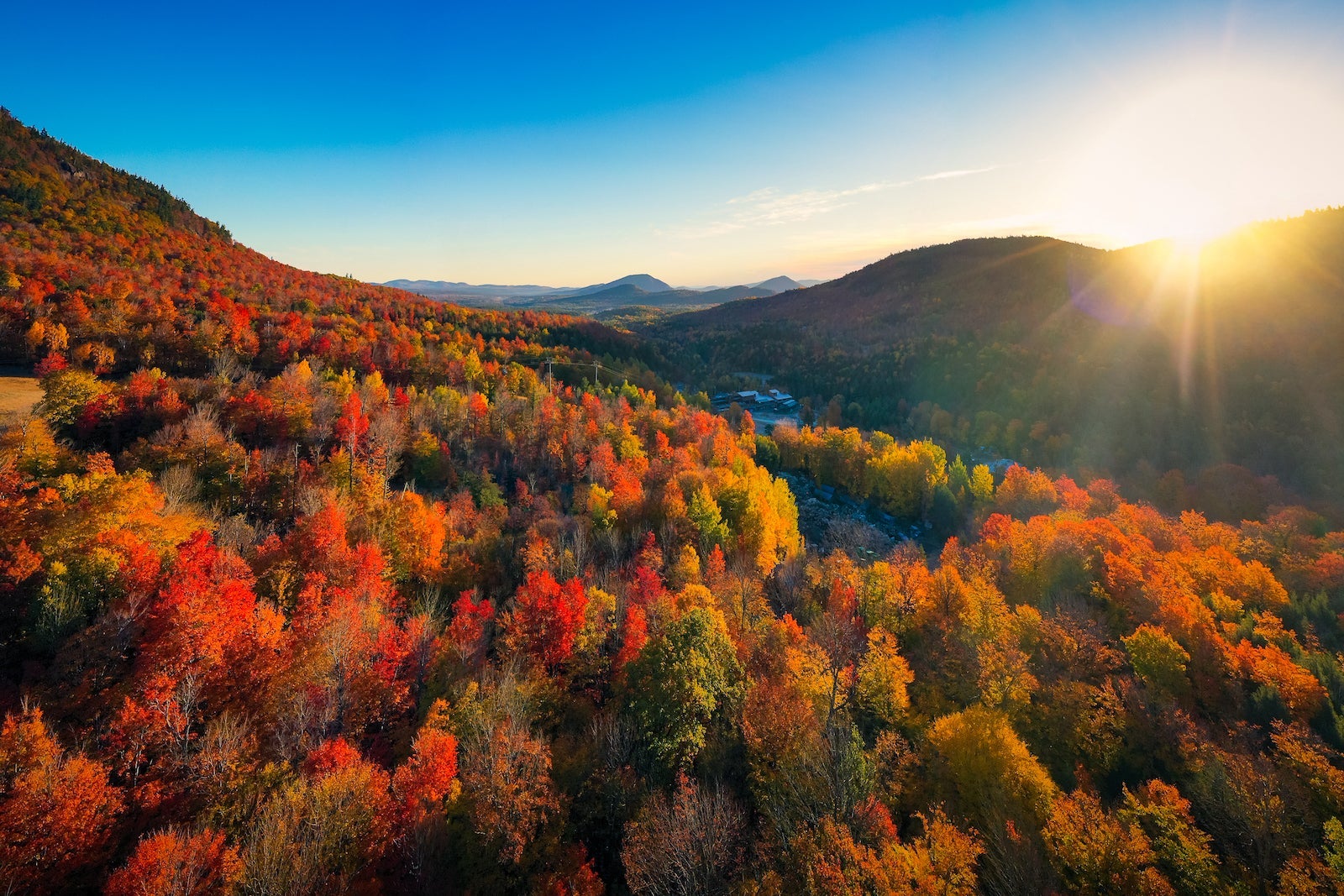 Aerial view of Mountain Forests with Brilliant Fall Colors in Autumn at Sunrise, New England