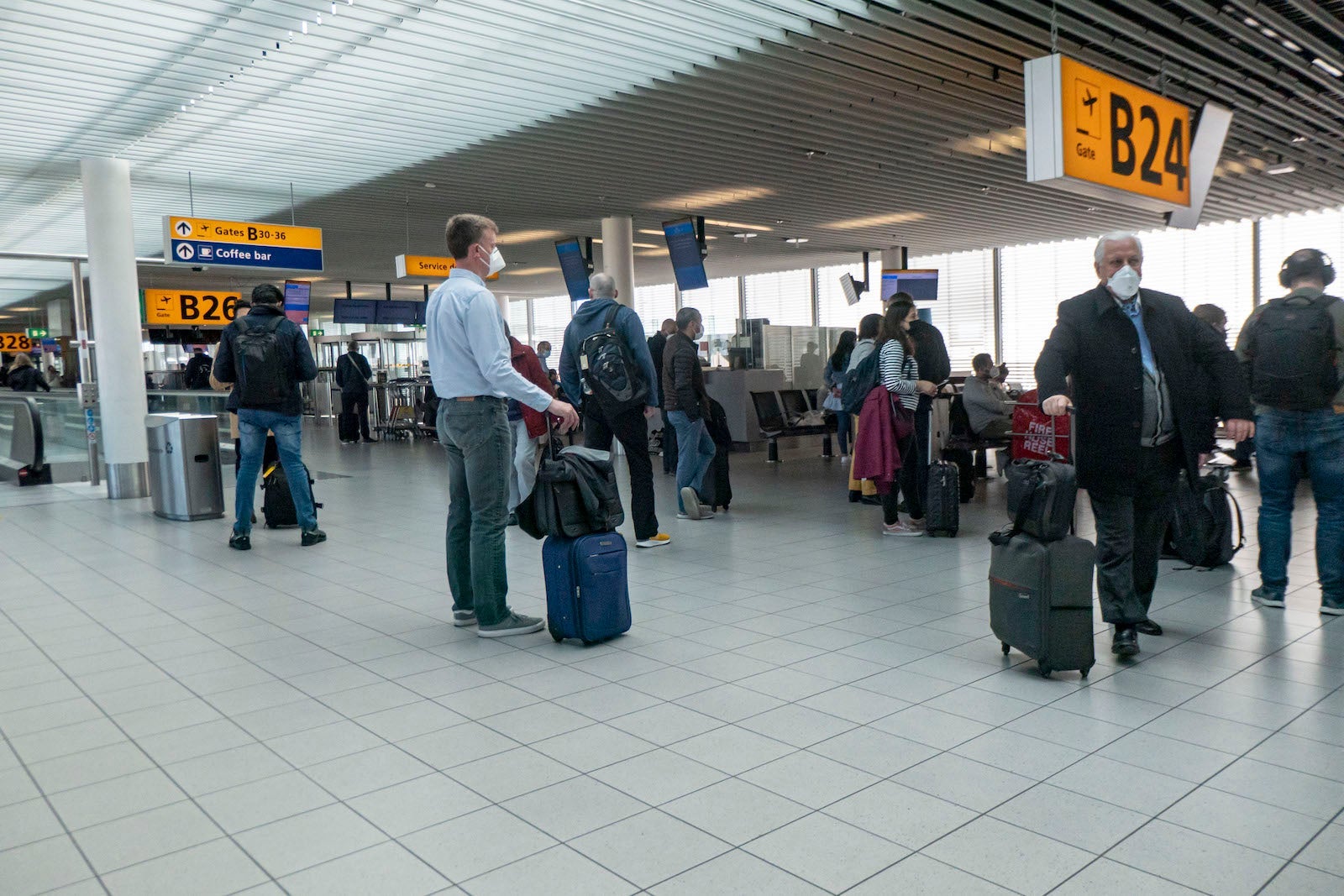 Passengers Wearing Face Masks In Amsterdam Schiphol Airport