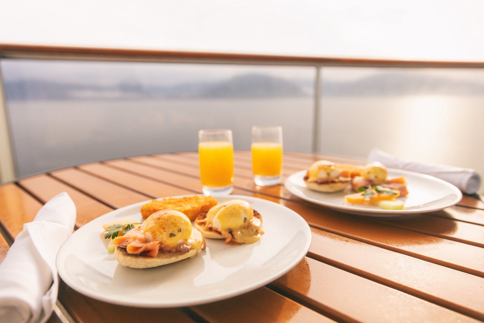 Cruise ship vacation food breakfast on suite balcony table in room service. Caribbean travel getaway, winter escape or honeymoon cruise in Europe or Santorini