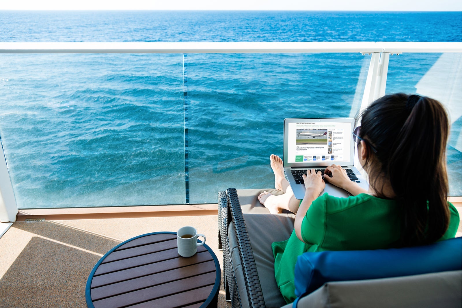 Woman working with a laptop on cruise ship