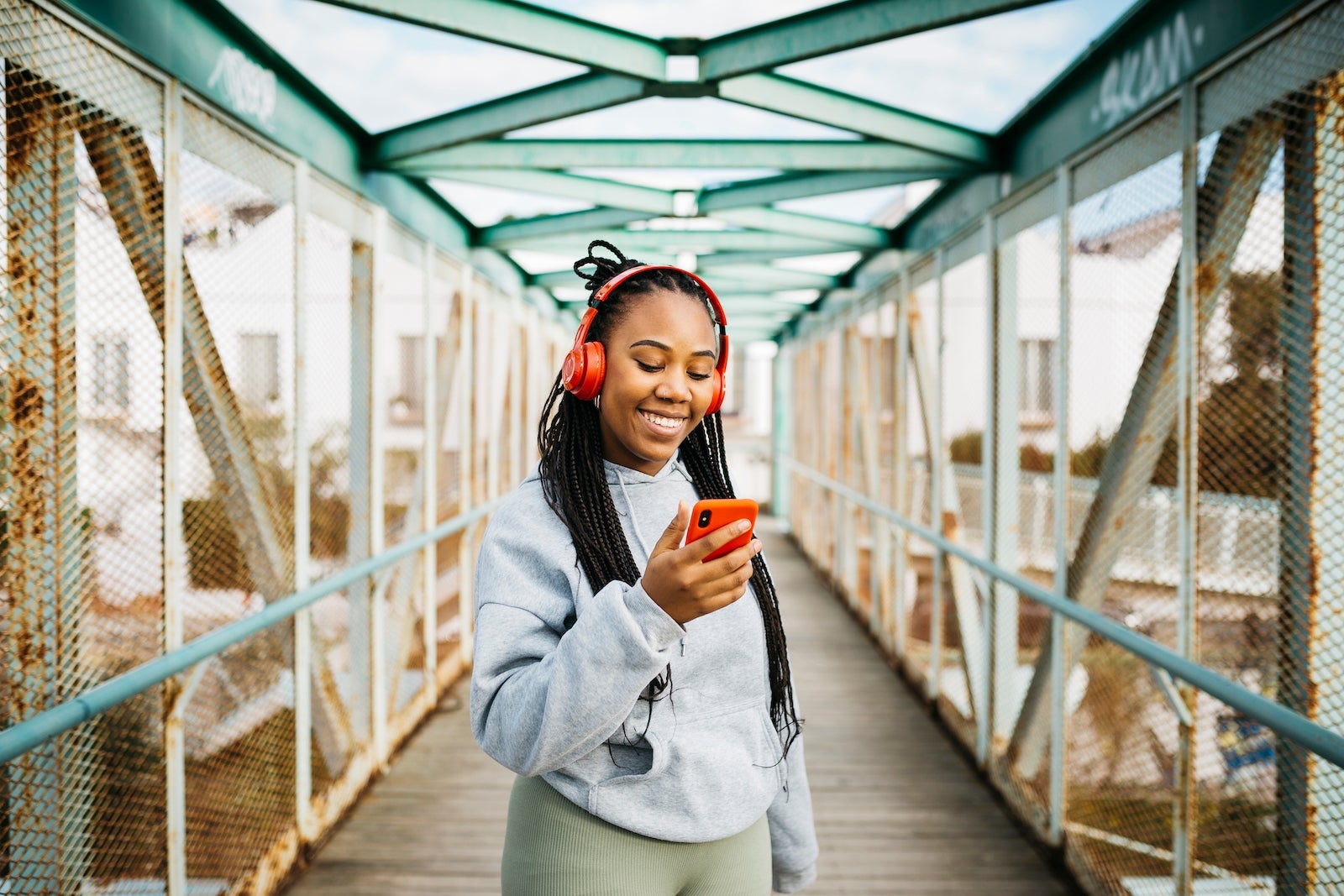Woman using a smartphone and headphones