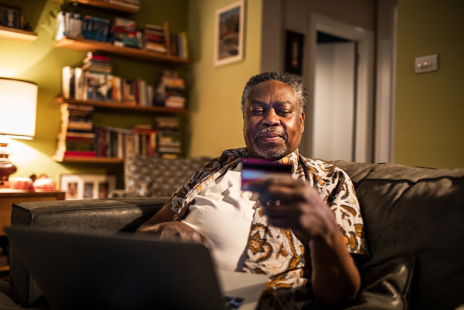 Senior man online shopping from home