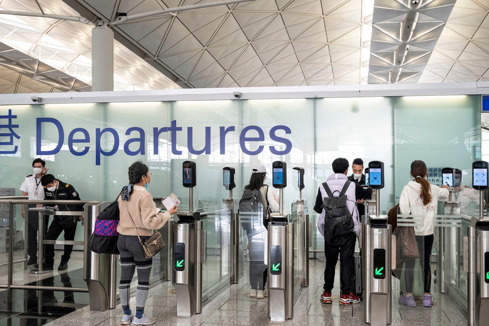 Passengers go through the departure hall in Hong Kong's Chek