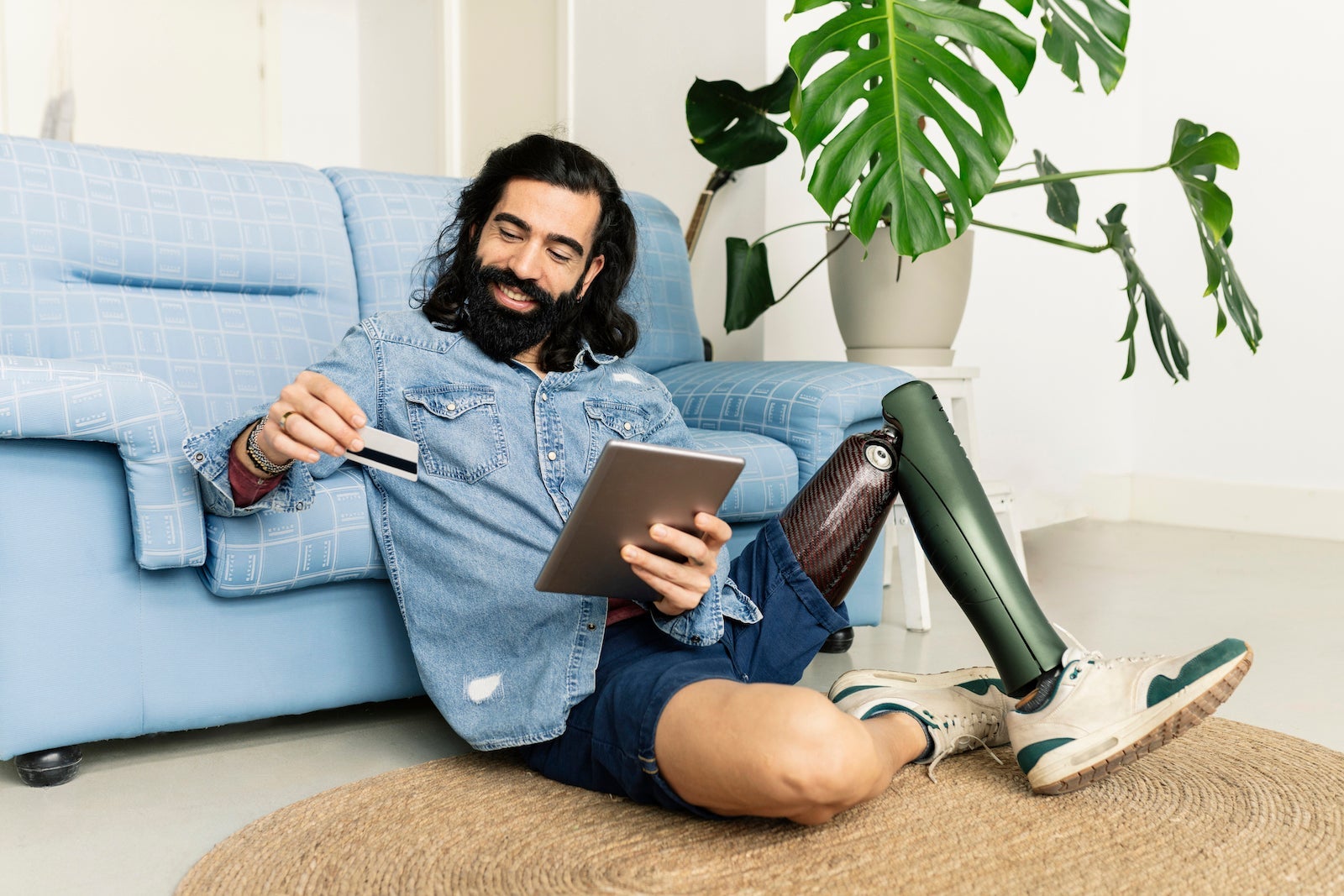 man with prosthetic leg buying online