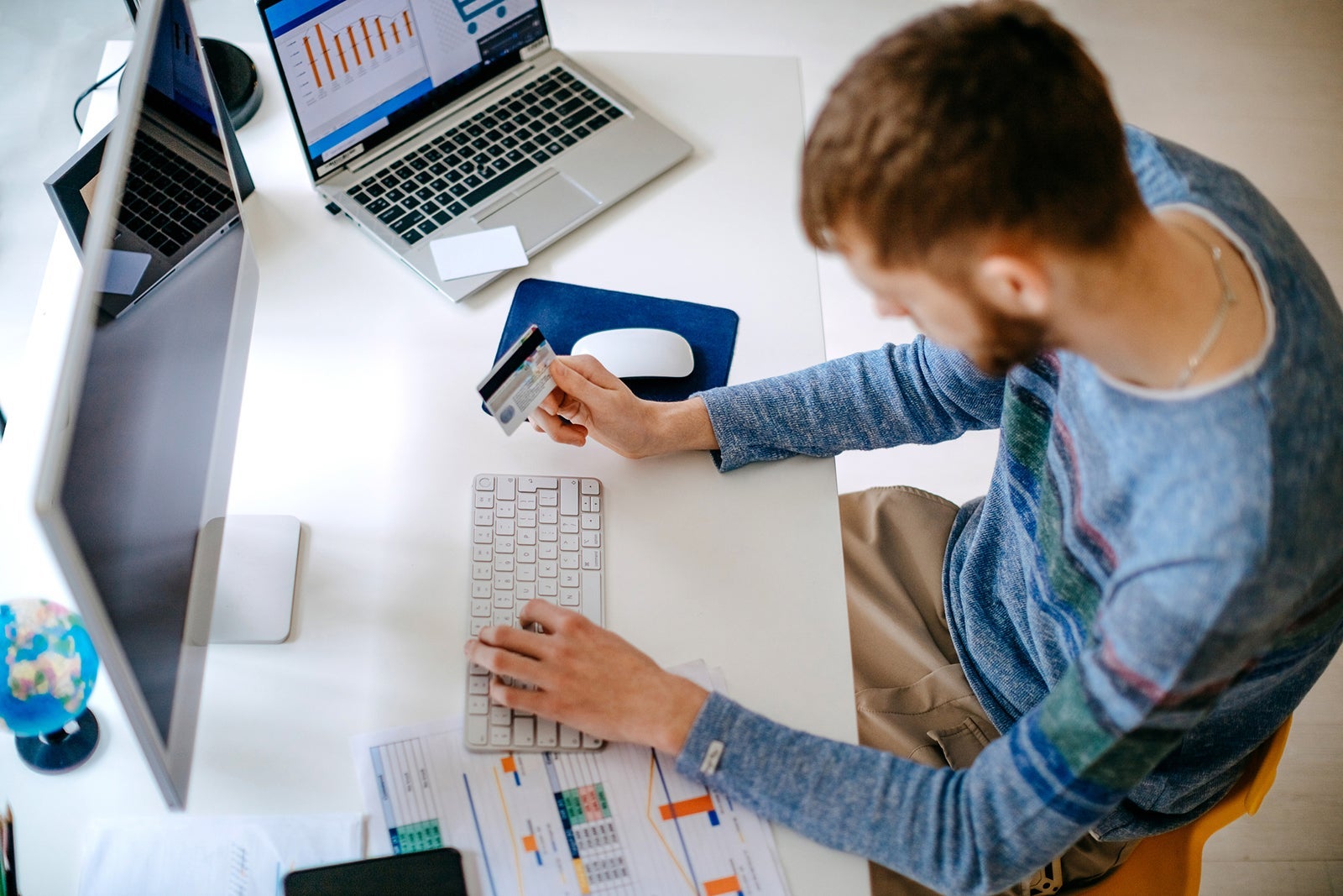 Single person shopping at home using credit card