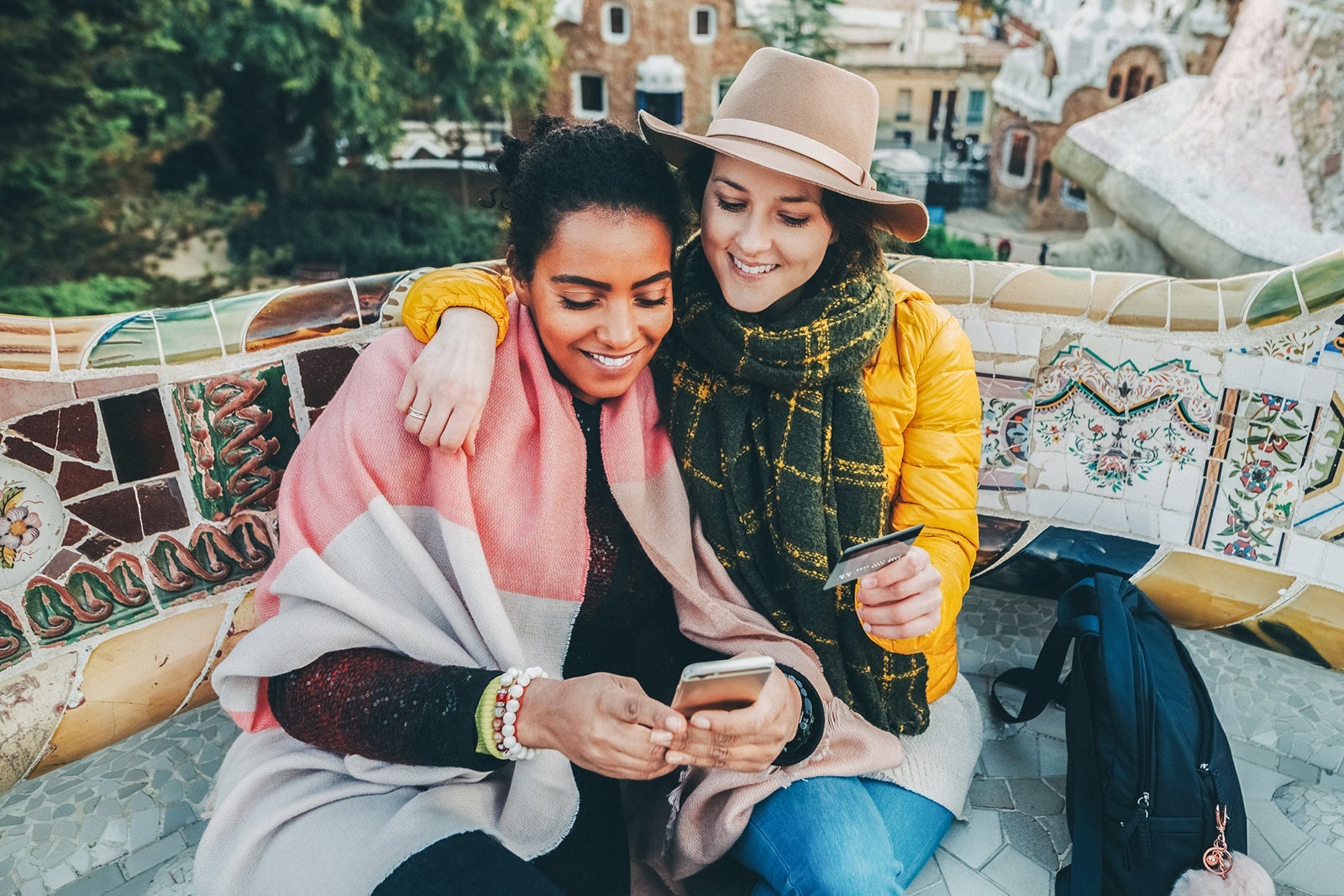 Friends in Spain using credit card to make a reservation