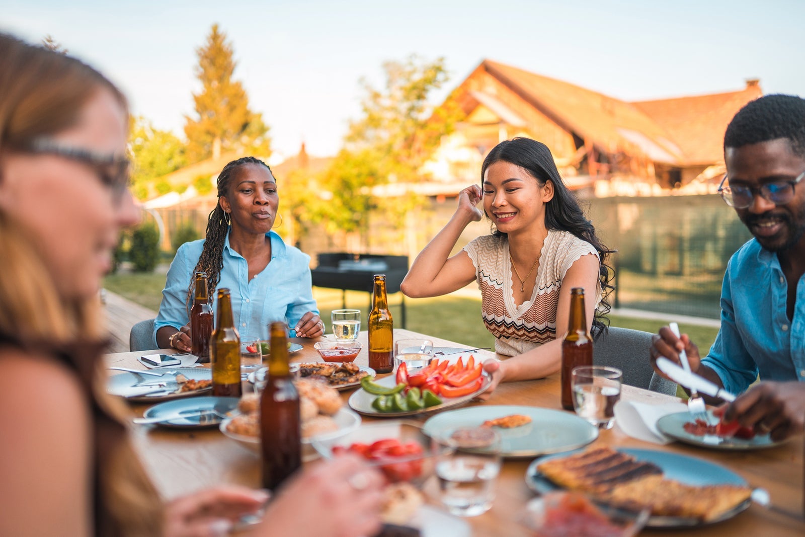 Exchange Students Having Fun And Eating Outdoors