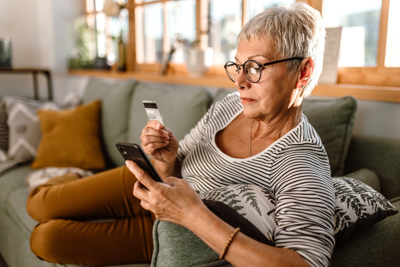 Senior woman online shopping at home