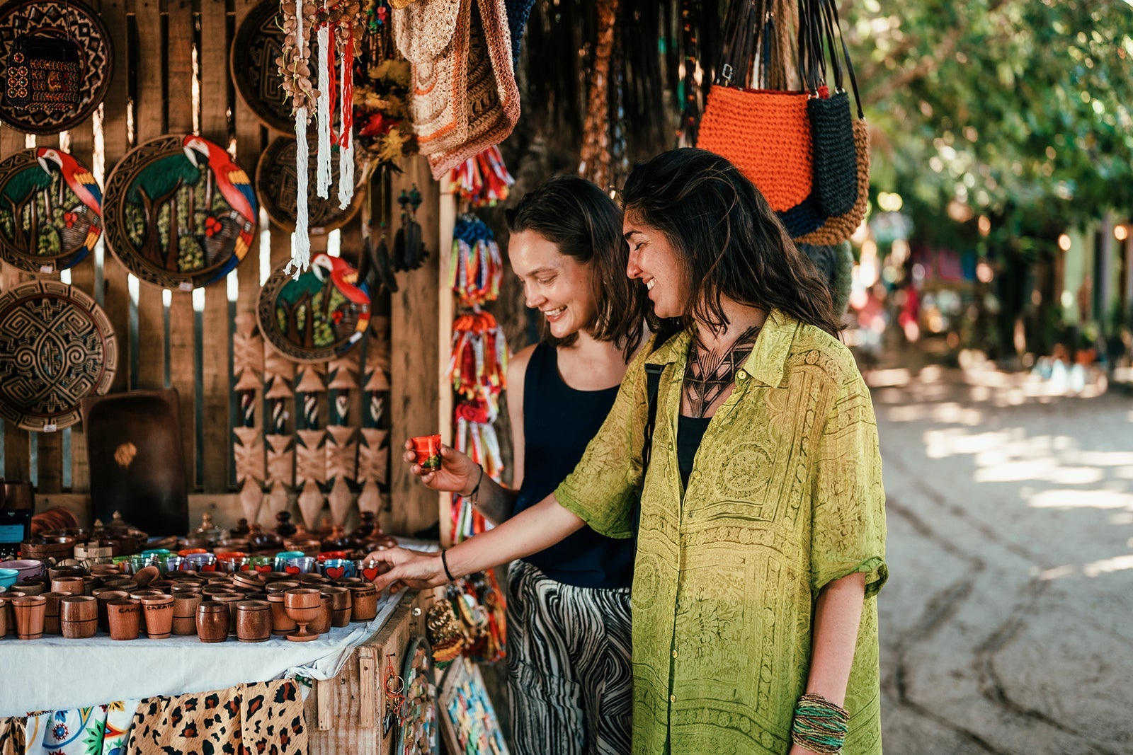 Two friends in front of a souvenir stall