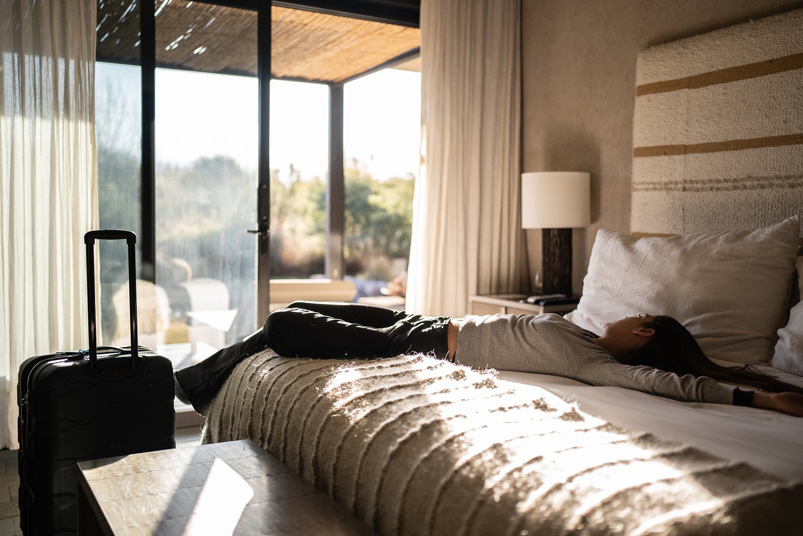 Woman arrival and resting in a hotel