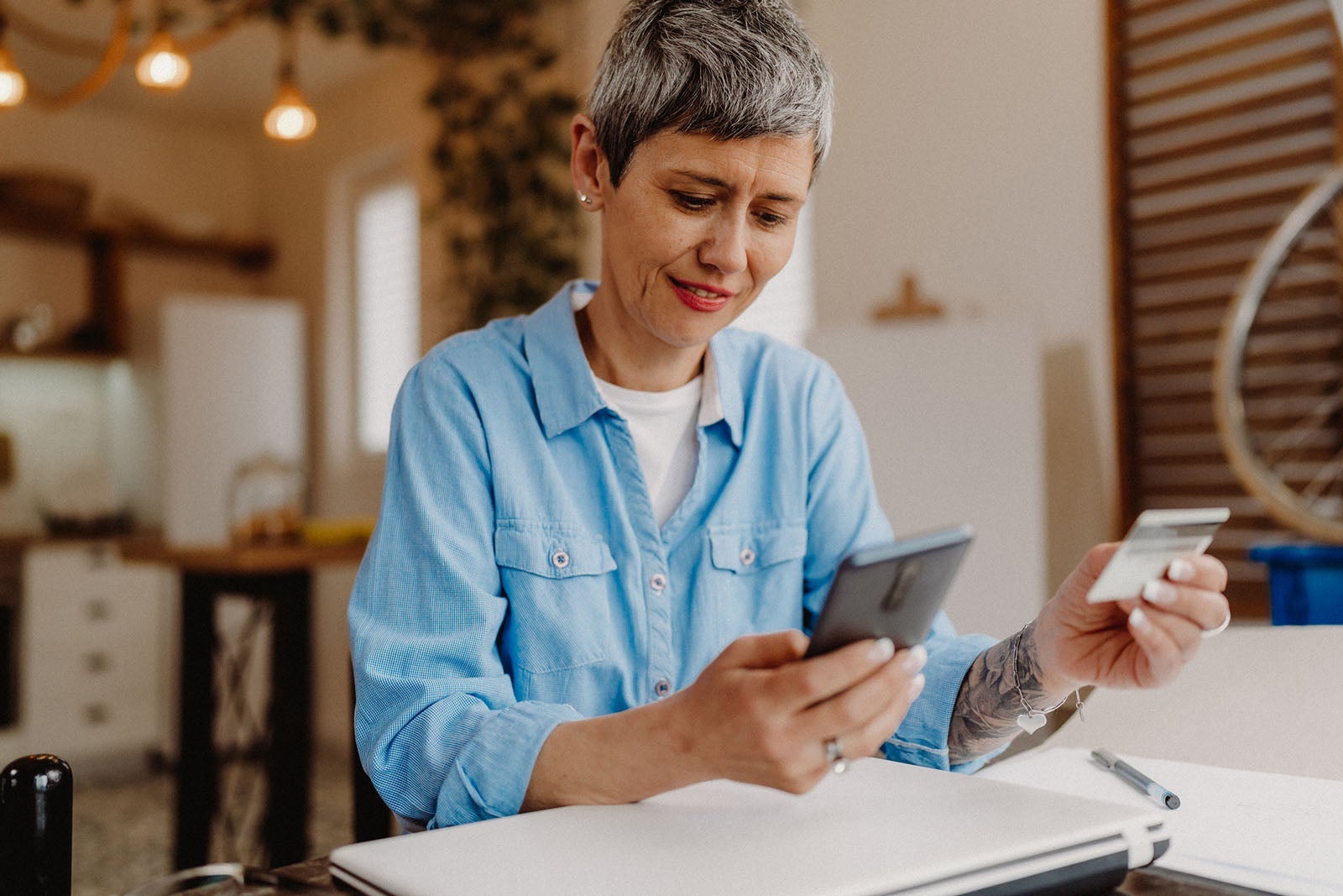 Senior woman using her credit card
