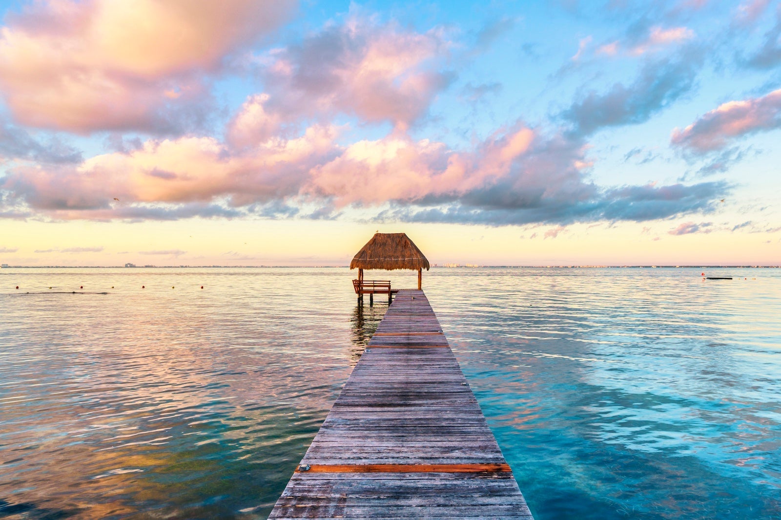 Palapa and wooden pier on the Carribean Sea, Mexico