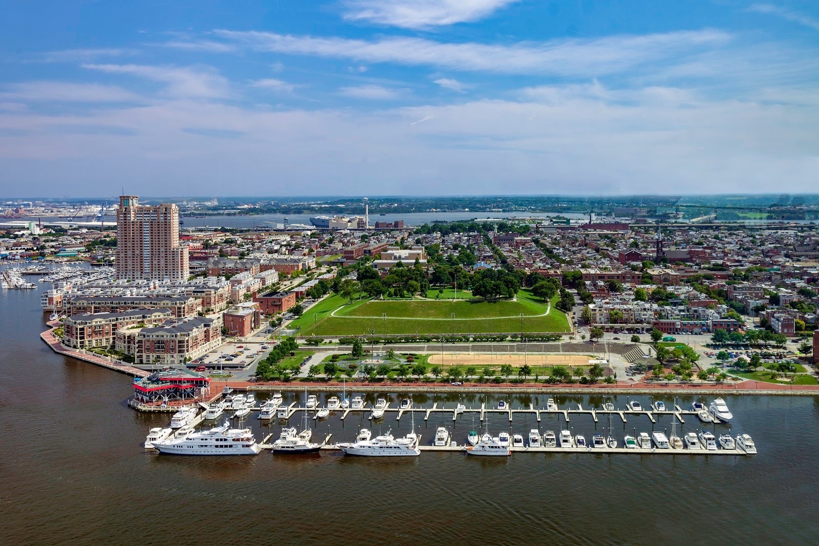 Aerial view of the Baltimore Inner Harbor, the homes and Condominiums overlooking a Marina, and the famous Federal Hill Park in Baltimore, Maryland