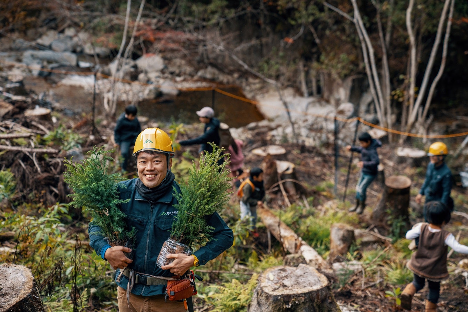 Forester with seedlings at a volunteer tree planting and reforestation event