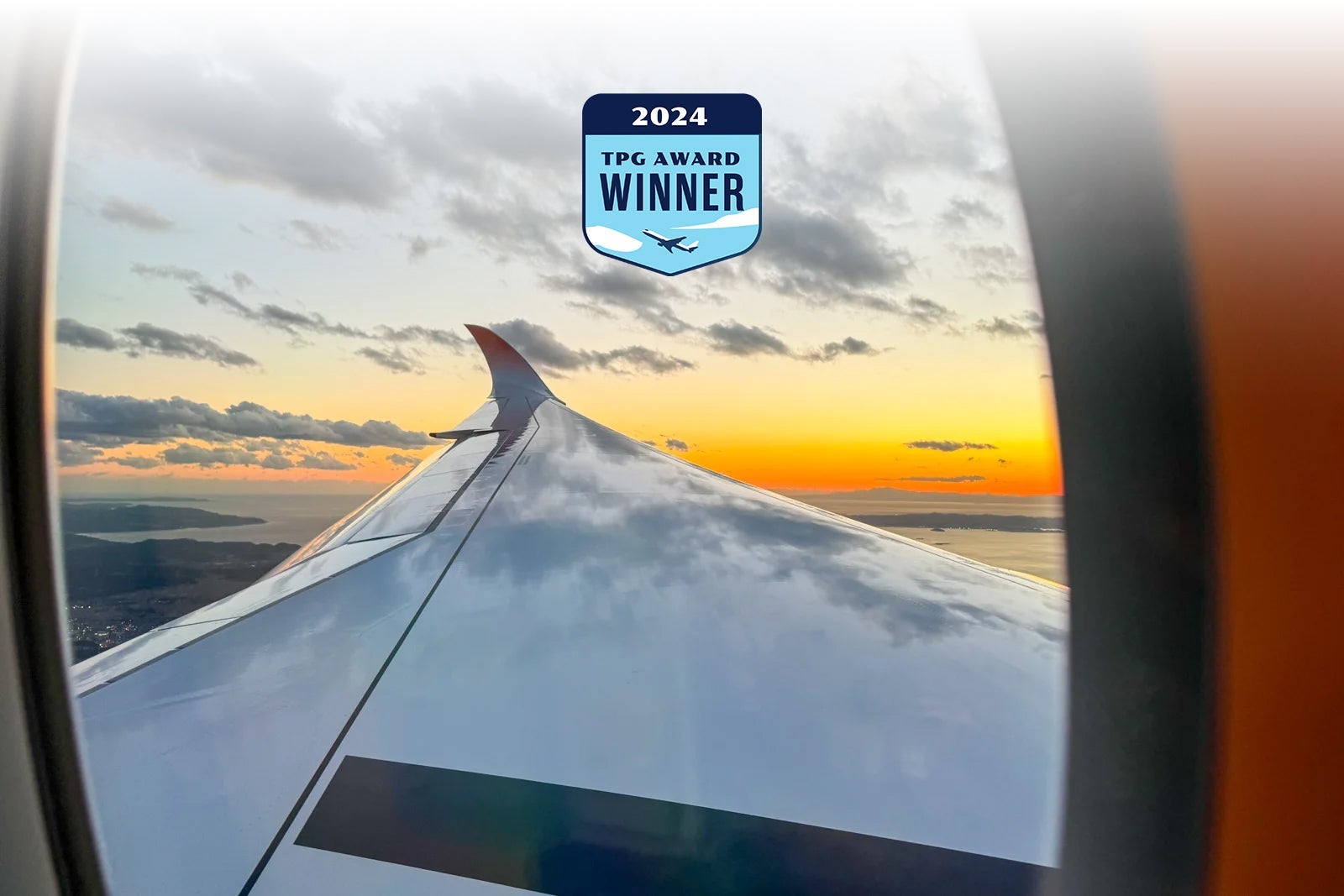 20240125_JAL-A350-1000-Inaugural_ERosen-wing-reflecting-sky