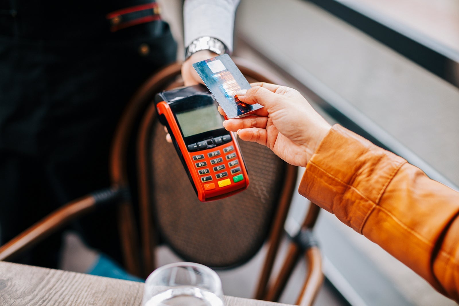 Paying by credit card at the coffee shop table