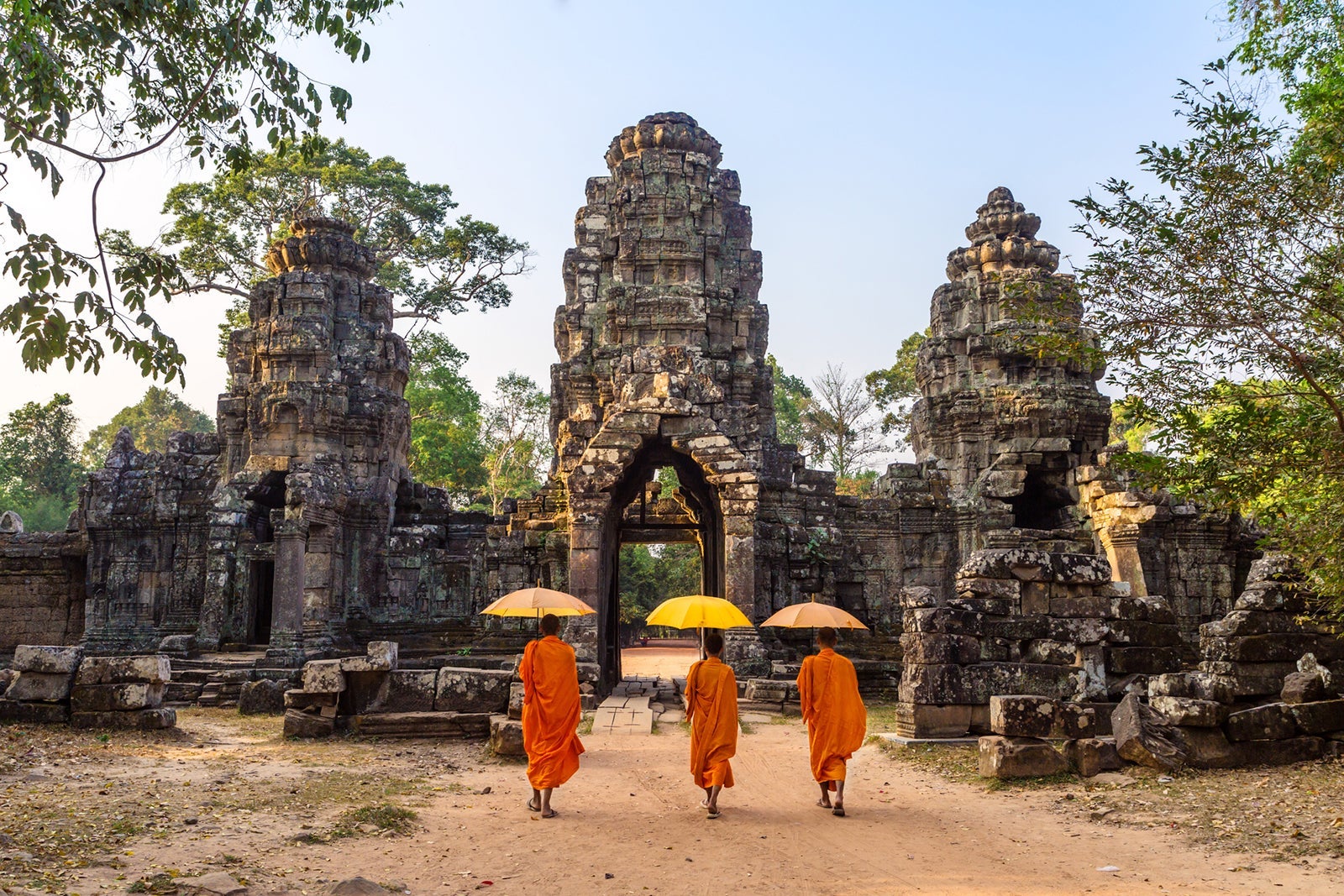 Buddhist monks walking inside Angkor Wat temple