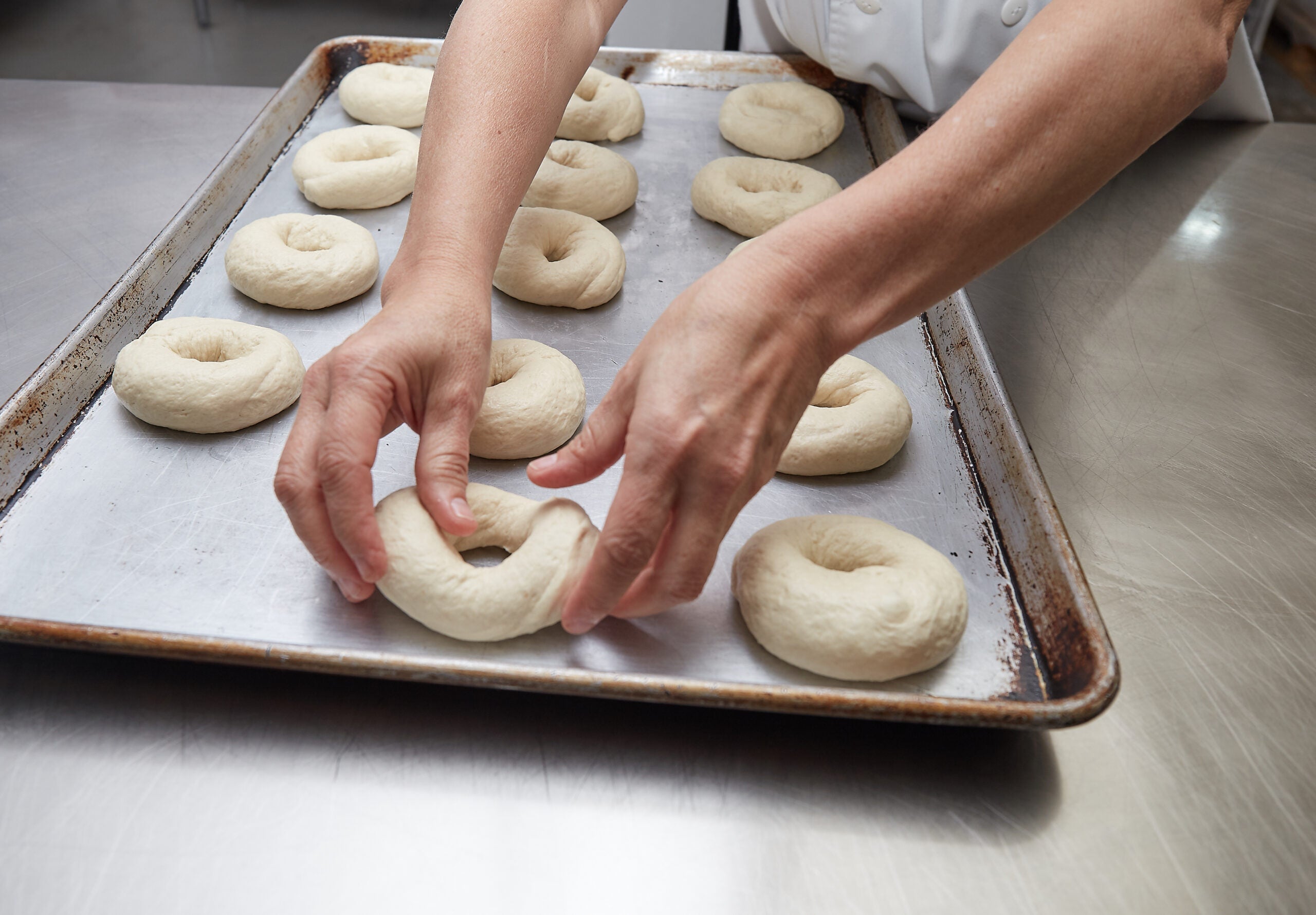 baker making bagel