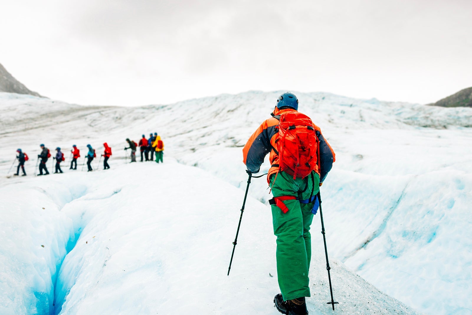 Exit Glacier ice hiking. People wearing ice crampons and walking on glaciers. Kenai Fjords National Park. Alaska.