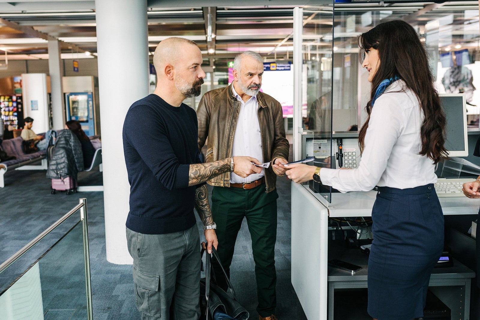 A Gay Couple Boarding Plane At An Airport Gate