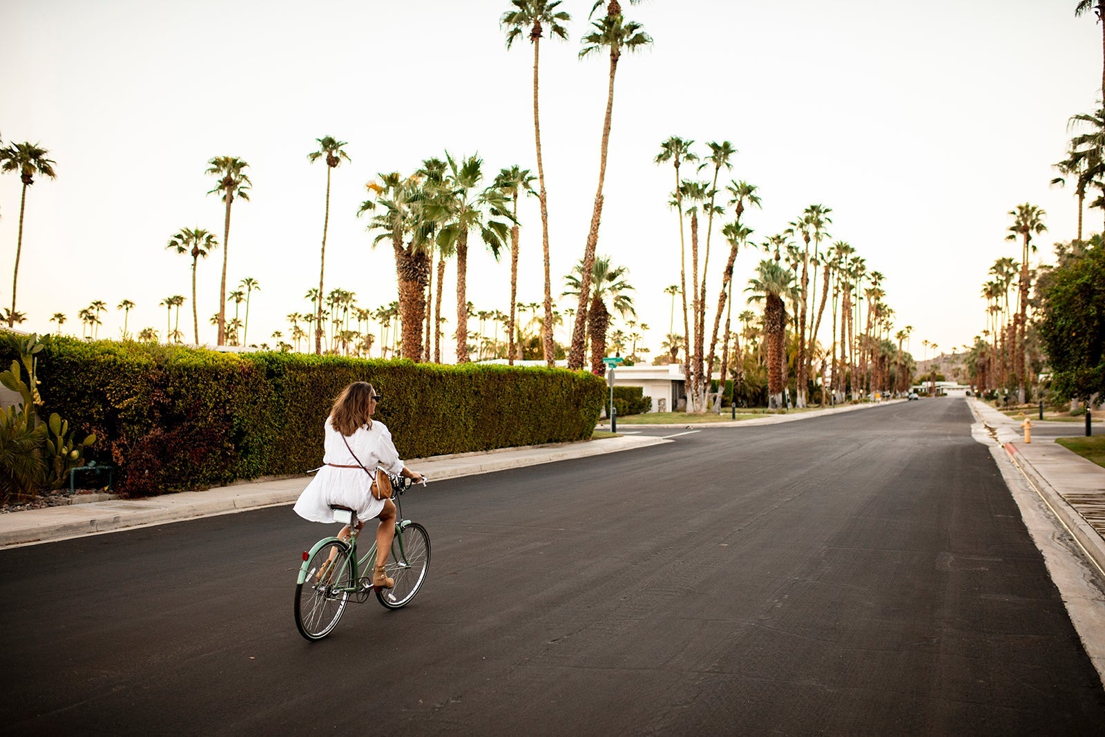 USA, California, Palm Springs, woman riding bicycle on the street