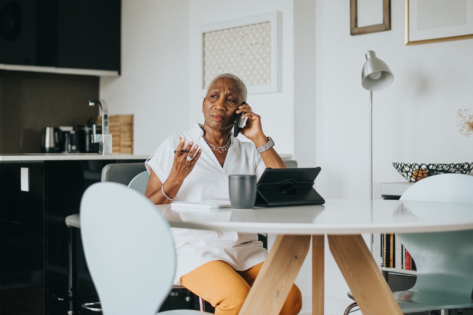 Senior black woman working from home on laptop computer