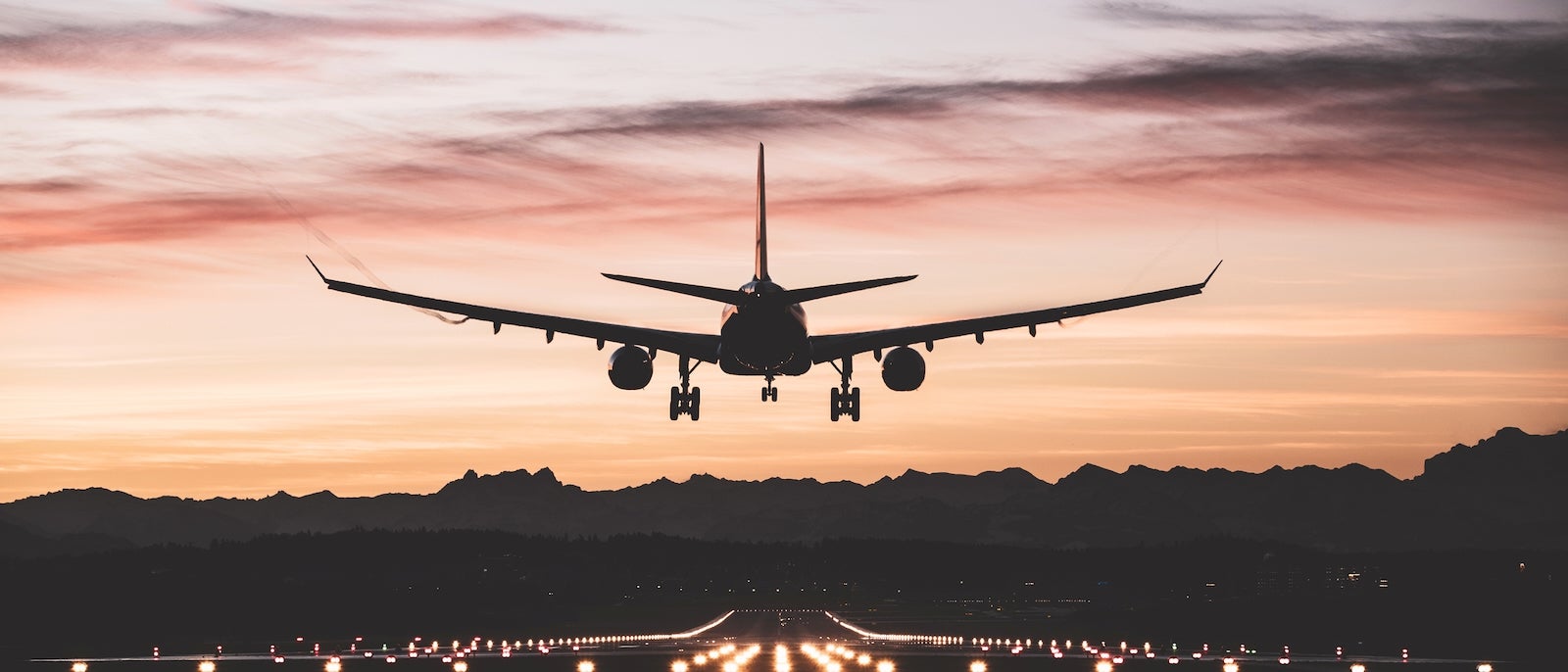 Aircraft landing at sunrise