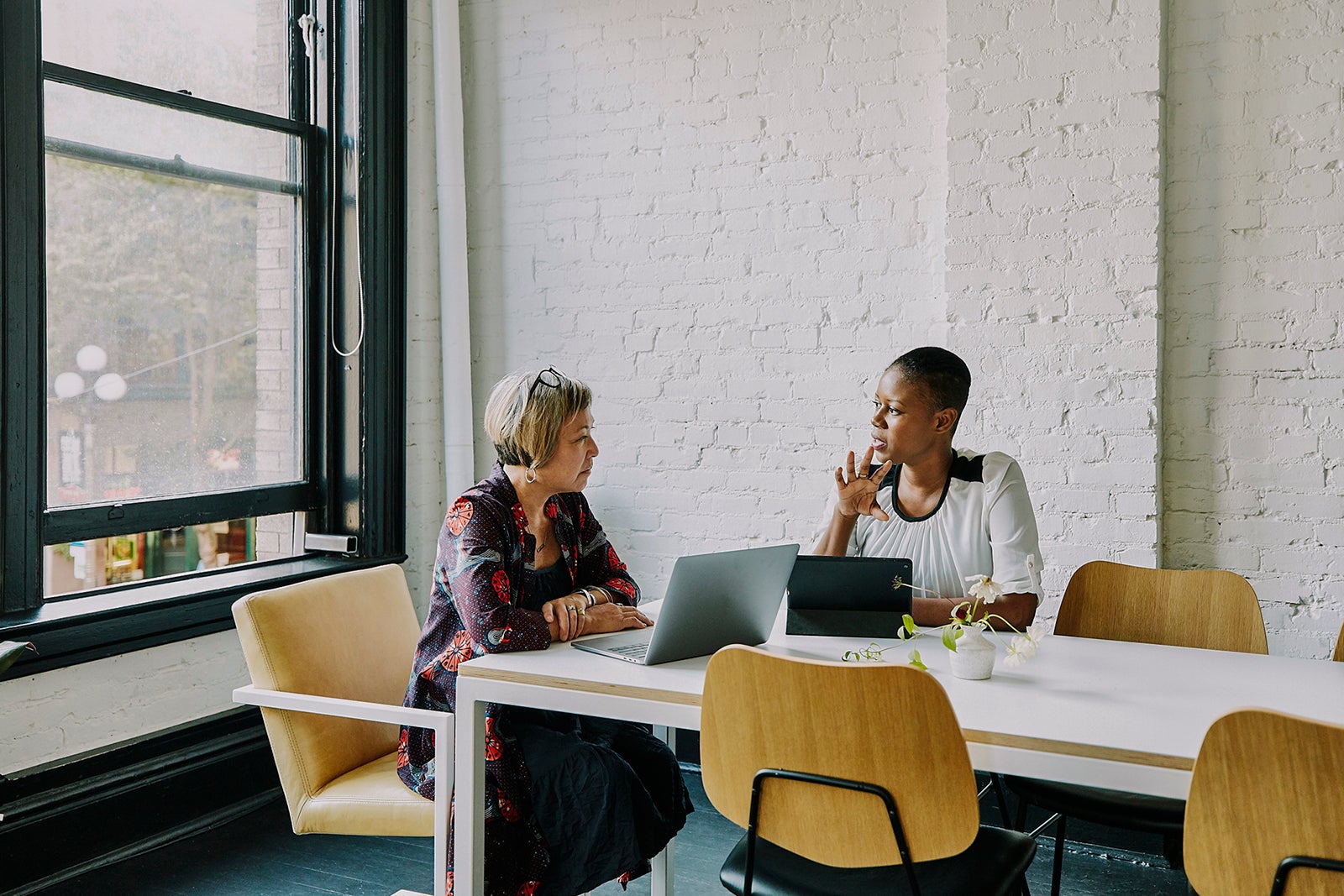 Businesswoman meeting with financial advisor in office conference room