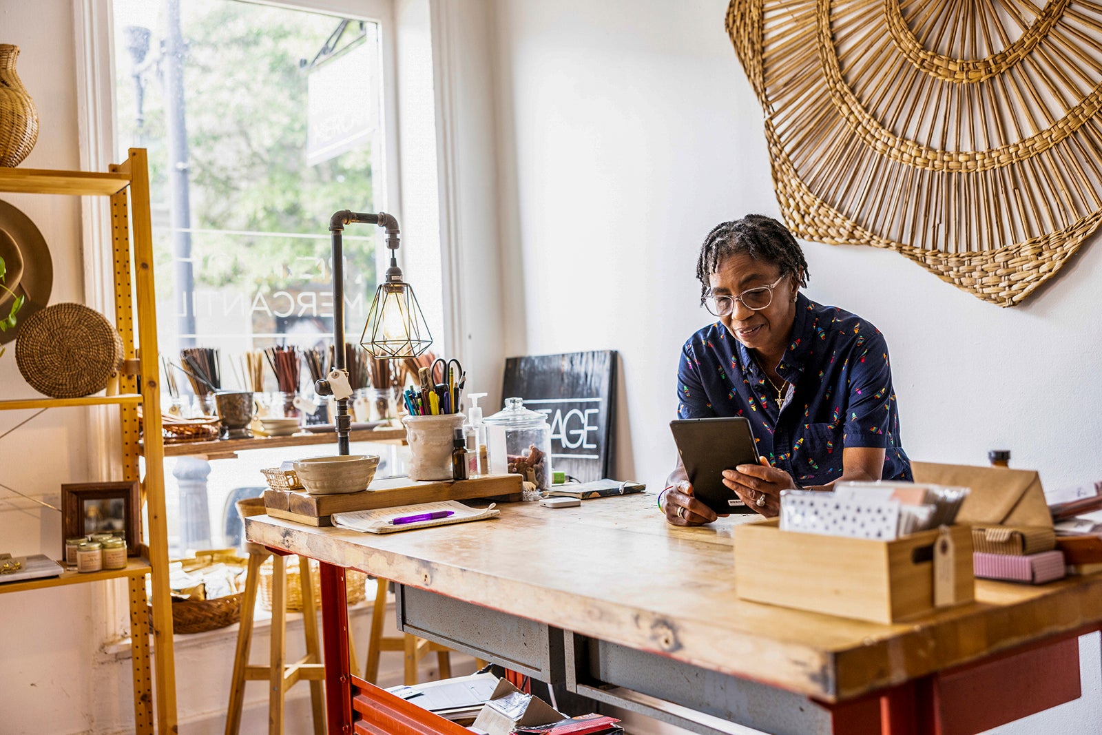 Female small business using smartphone in her store