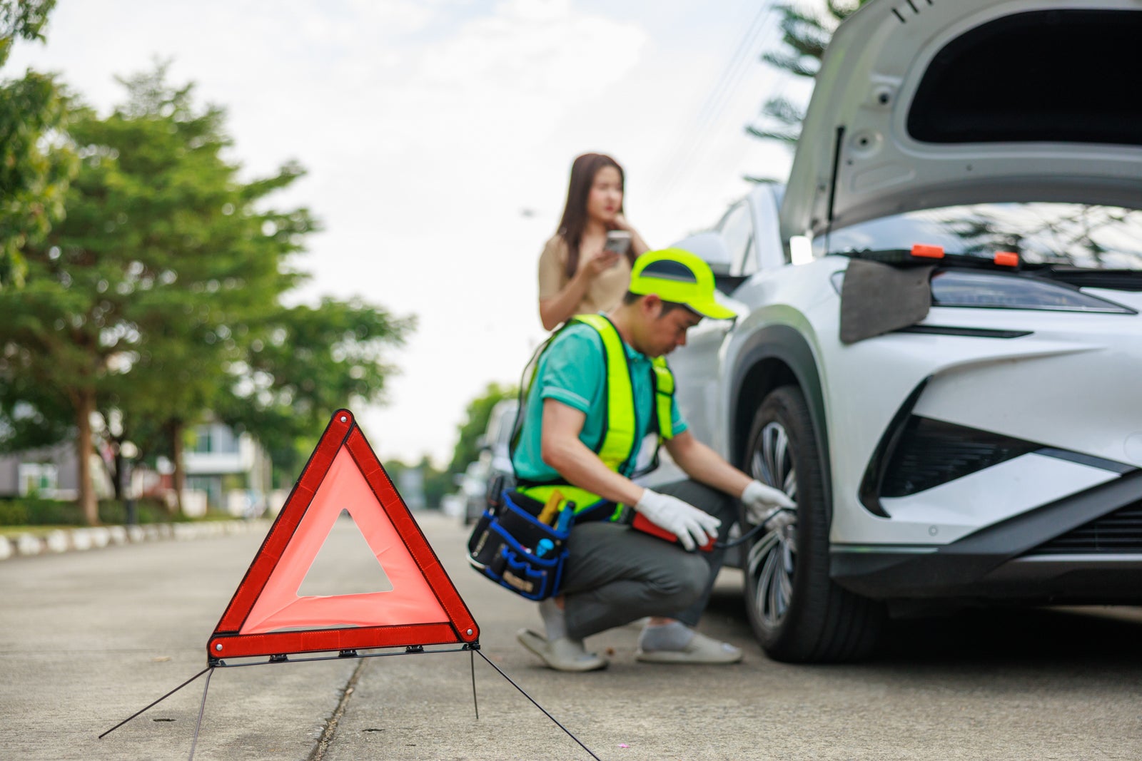A mechanic offers roadside assistance