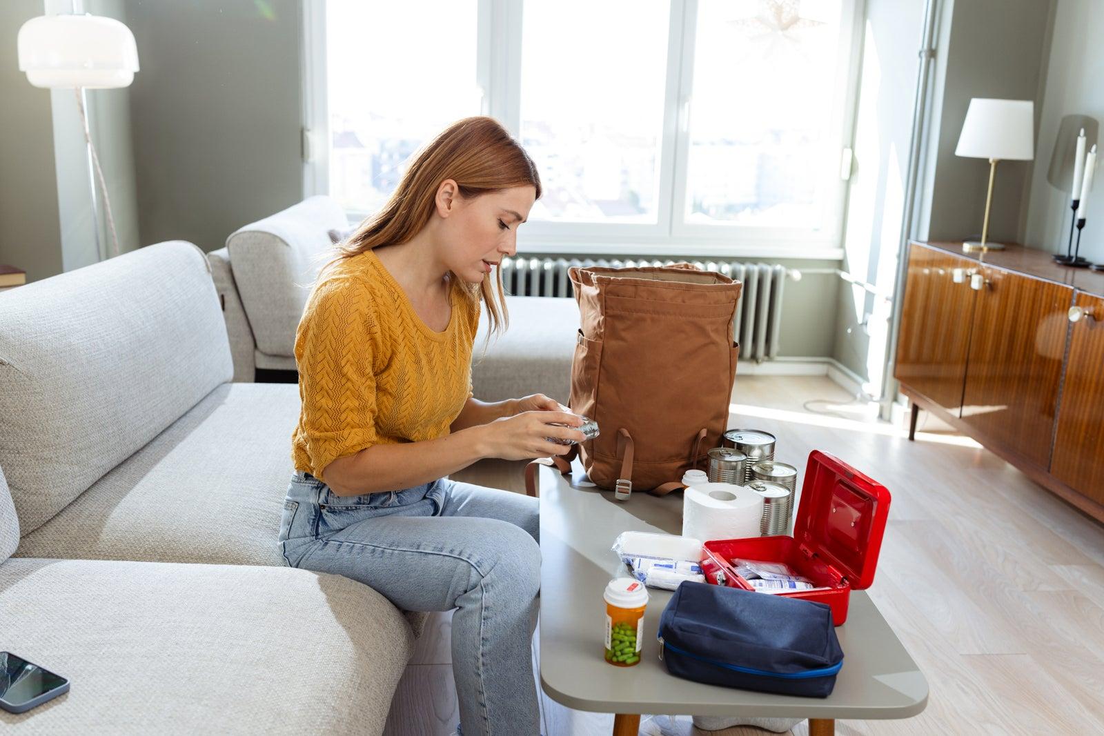 Woman preparing first aid kid