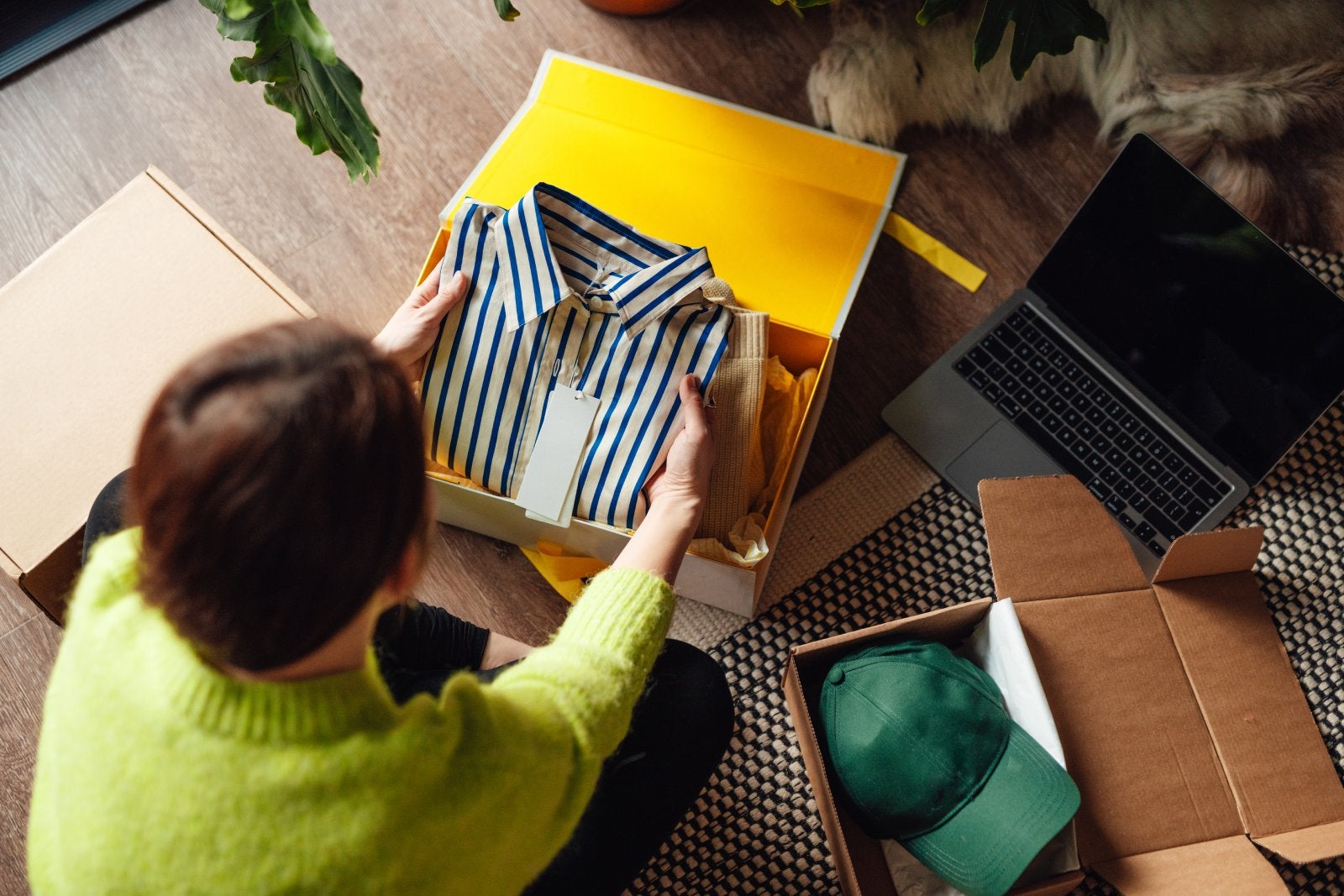 woman opening package received from online shopping