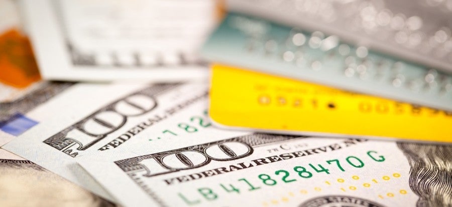 Credit cards and cash featured shutterstock 196399979