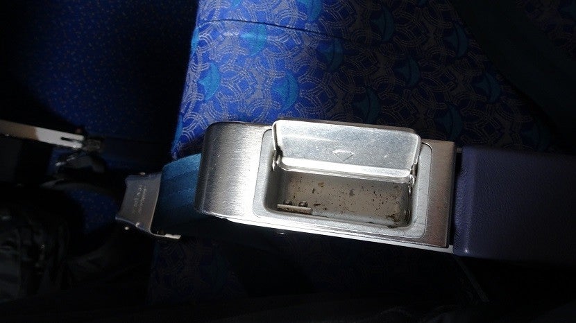 A working armrest ashtray -- A whiff of aviation nostalgia.