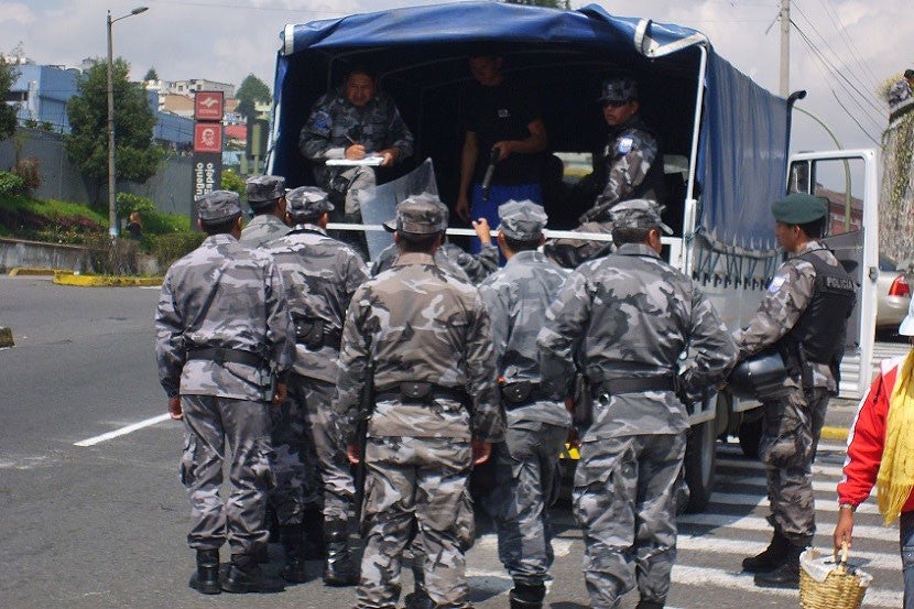 Alone or not, in retrospect it probably wasn't a great idea to take photos of heavily armed Ecuadorian police preparing to deal with protesters.