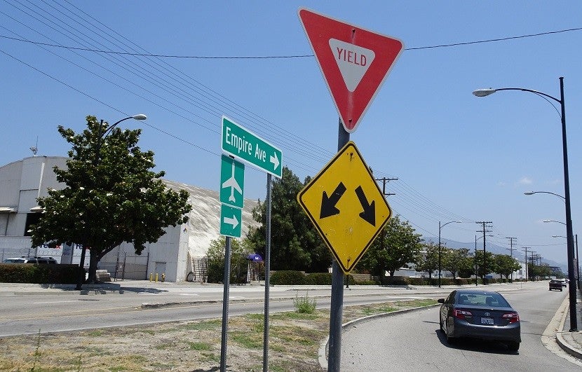 Don't believe the sign — the airplane you want is the other way.