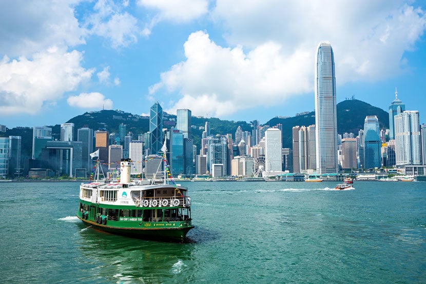 The iconic Star Ferry offers lovely views of Victoria Harbour. Image courtesy of <a href="http://www.shutterstock.com/pic-310256879/stock-photo-hong-kong-august-4-2015-hong-kong-international-finance-centre-2ifc-2-4158-m-on-august-4-2015-hong-kongs-famous-landmarks-completed-in-2003.html?src=undefined-1-0" target="_blank">Shutterstock</a>.