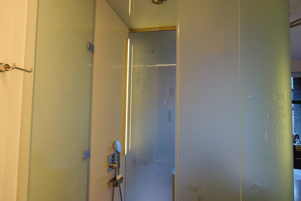 Inside the phone booth–inspired shower. I liked the touch-button controls here.